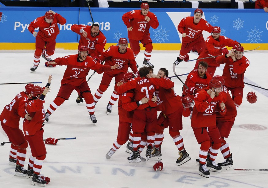 epa06563357 Team Olympic Athletes of Russia (OAR) celebrate with Kirill Kaprizov of Olympic Athletes of Russia (OAR) (C, number 77) after he scored the winning goal at the end of the Men&#039;s Ice Ho ...