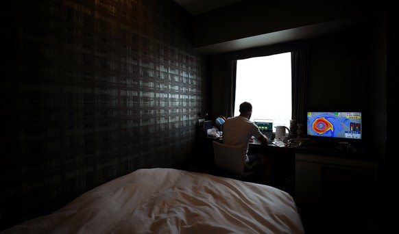 epa09357960 A photographer takes self portraits of daily life in mandatory hotel quarantine in Tokyo, Japan, 22 July 2021, ahead of the start of the Tokyo Olympic Games. EPA/JOE GIDDENS AUSTRALIA AND  ...