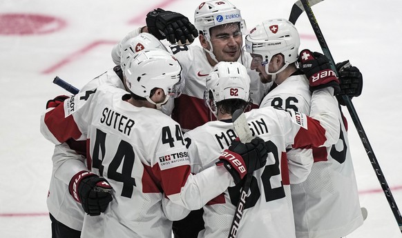 Denis Malgin of Switzerland is celebrated after he scored his side&#039;s 6th goal during the group A Hockey World Championship match between Denmark and Switzerland in Helsinki, Finland, Sunday May 1 ...