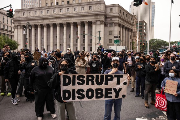 EDS NOTE: OBSCENITY - Demonstrators gather to protest against deportation by Immigration and Customs Enforcement outside Jacob K. Javits Federal Building in New York, Monday, June 9, 2025. (AP Photo/Y ...