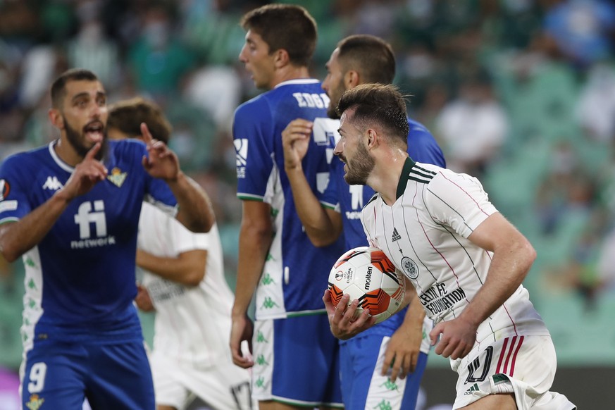 Celtic&#039;s Albian Ajeti, right, celebrates after his teammate Celtic&#039;s Anthony Ralston scores his side&#039;s third goal during the Europa League Group G soccer match between Real Betis and Ce ...