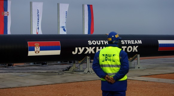 epa04511704 (FILE) A file photo dated 24 November 2013 showing a worker next to steel pipes during the ceremony marking the start of the construction of the South Stream gas pipeline, at a field north ...