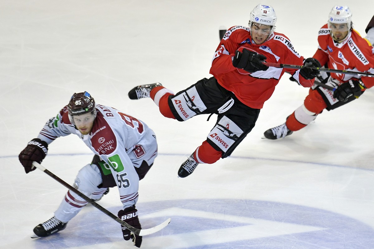 Swiss Nico Hischier, right, in action against Latvias's player Oskars Batna , left, during the friendly Ice Hockey match between Switzerland and Latvia in Herisau, Switzerland, 03, May 2019. (KEY ...