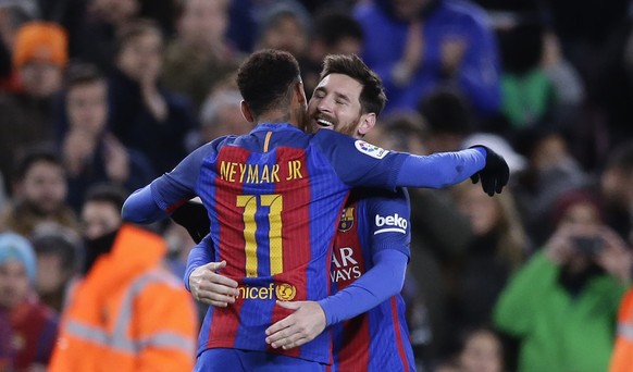 FC Barcelona's Lionel Messi, right, celebrates after scoring with his teammate Neymar during a Copa del Rey, 16 round, second leg, between FC Barcelona and Athletic Bilbao at the Camp Nou in Barcelona ...