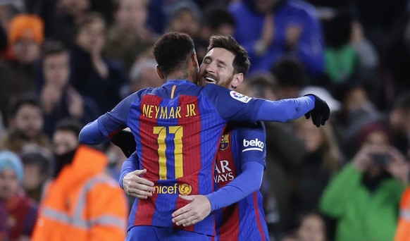 FC Barcelona's Lionel Messi, right, celebrates after scoring with his teammate Neymar during a Copa del Rey, 16 round, second leg, between FC Barcelona and Athletic Bilbao at the Camp Nou in Barc ...
