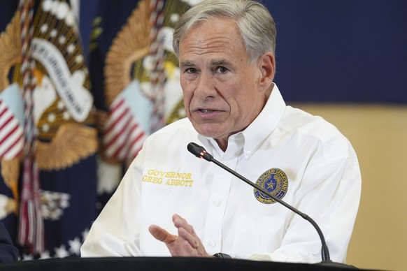 Texas Gov. Greg Abbott speaks during a roundtable discussion with President Donald Trump, first responders and local officials at Hill Country Youth Event Center in Kerrville, Texas, during a tour to  ...