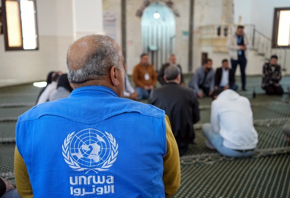 epa12034994 A delegation from the United Nations Relief and Works Agency for Palestine Refugees in the Near East (UNRWA) meets with Palestinians in the Haifa al-Carmel camp, in rural Idlib, northweste ...