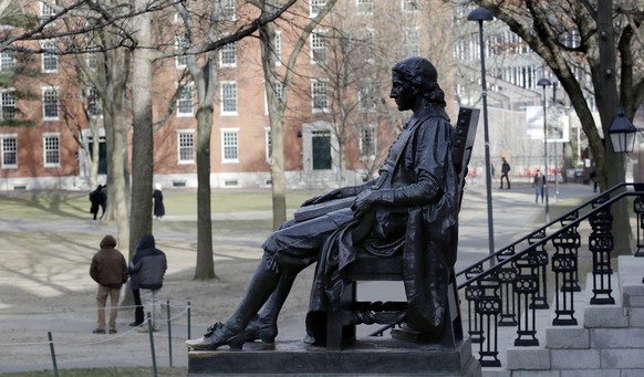 FILE - In this Dec. 13, 2018 file photo, the John Harvard statue looks over Harvard Yard at Harvard University in Cambridge, Mass. A final round of arguments is scheduled for Wednesday, Feb. 13, 2019, ...