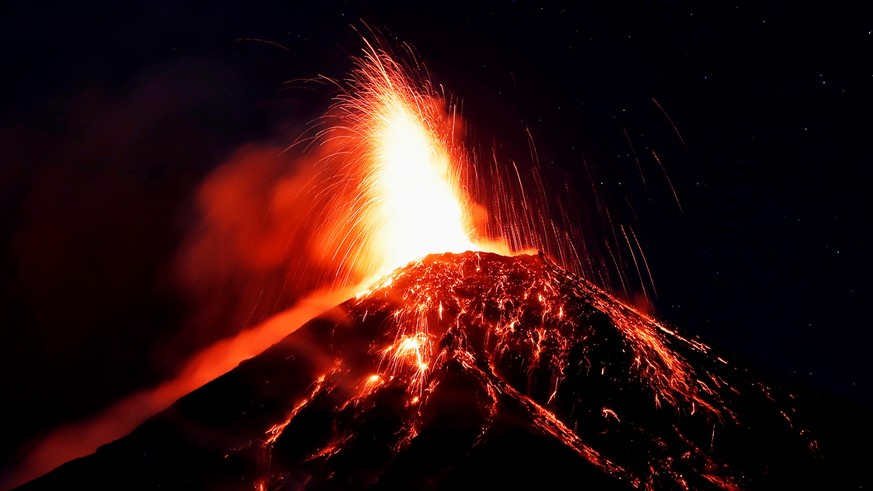 epa07176449 Volcan de Fuego (Volcano of Fire) mount spews hot ashes and lava, as seen from Alotenango, Guatemala, 18 November 2018 (issued on 19 November 2018). The volcano has erupted for fifth time  ...