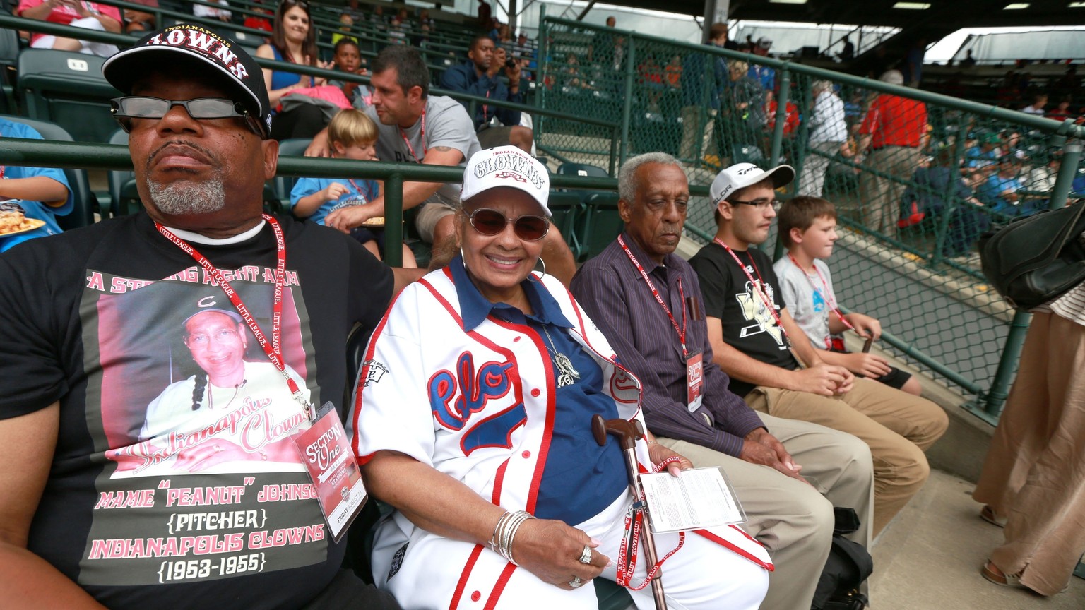 FILE - In this Aug. 15, 2014, file photo, Mamie &quot;Peanut&quot; Johnson, second from left, watches Taney Dragons&#039; Pennsylvania pitcher Mo&#039;ne Davis pitch during a baseball game against Ten ...