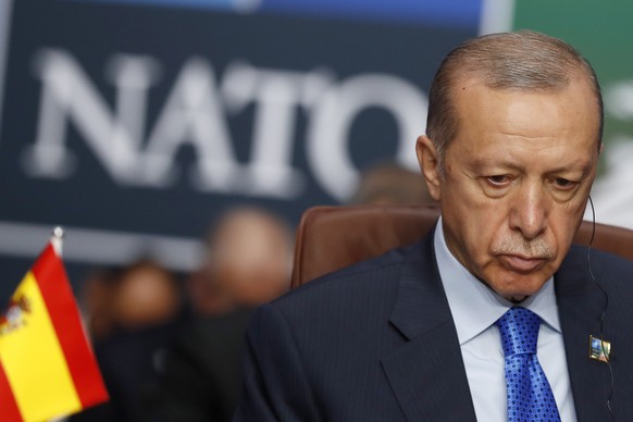 FILE - Turkish President Recep Tayyip Erdogan waits for the start of a round table meeting of the North Atlantic Council during a NATO summit in Vilnius, Lithuania, on July 11, 2023. Sweden edged clos ...