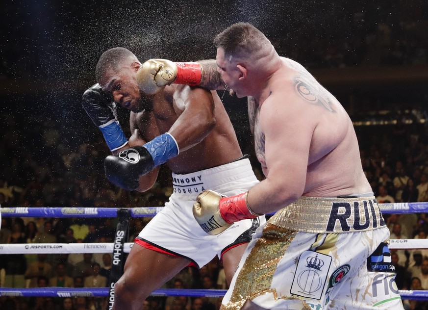 Andy Ruiz, right, punches Anthony Joshua during the seventh round of a heavyweight championship boxing match Saturday, June 1, 2019, in New York. Ruiz won in the seventh round. (AP Photo/Frank Frankli ...