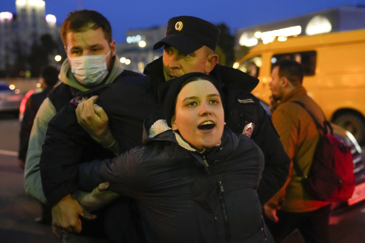 Riot police detain a demonstrator during a protest against mobilization in Moscow, Russia, Wednesday, Sept. 21, 2022. Russian President Vladimir Putin has ordered a partial mobilization of reservists  ...