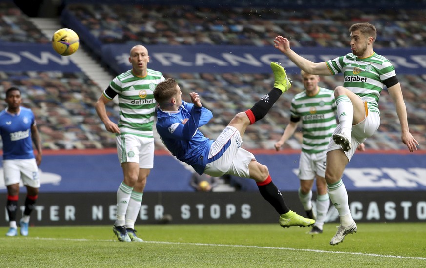 Rangers&#039; Steven Davis, center, scores against Celtic during the Scottish Cup fourth round match at Ibrox, Glasgow, Scotland, Sunday April 18, 2021. (Jane Barlow/PA via AP)