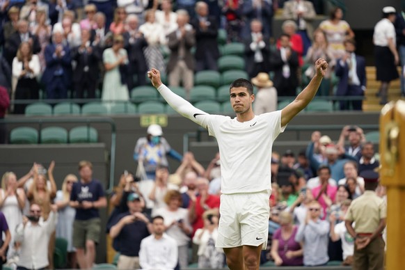 Spain&#039;s Carlos Alcaraz celebrates defeating Germany&#039;s Jan-Lennard Struff in their men&#039;s singles tennis match on day one of the Wimbledon tennis championships in London, Monday, June 27, ...