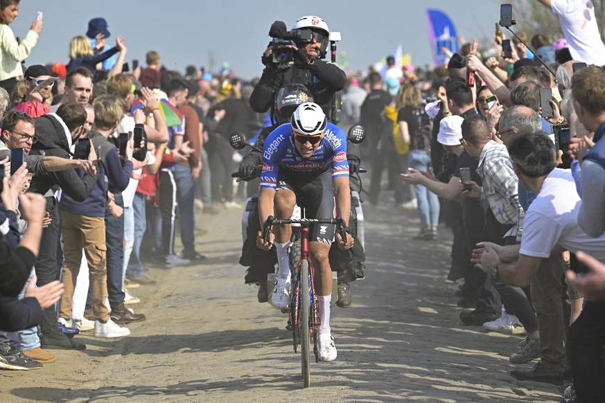 Mathieu Van Der Poel, of the Netherlands cycles over the Carrefour de l&#039;Arbre cobblestone sector during the men&#039;s Paris-Roubaix cycling race, at the velodrome in Roubaix, northern France, Su ...