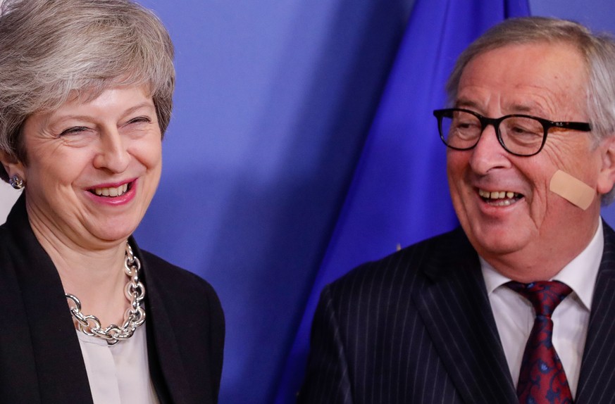 epa07383438 British Prime Minister Theresa May (L) is welcomed by European commission President Jean-Claude Juncker (R) ahead to a meeting on Brexit in Brussels, Belgium, 20 February 2019. May is in B ...