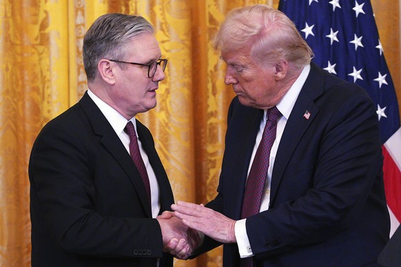 FILE - Britain&#039;s Prime Minister Keir Starmer, left, and U.S. President Donald Trump shake hands at a joint press conference in the East Room at the White House Thursday, Feb. 27, 2025, in Washing ...