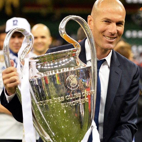 epa06775188 (FILE) - Real Madrid&#039;s head coach Zinedine Zidane celebrates with the trophy after winning the UEFA Champions League final between Juventus FC and Real Madrid at the National Stadium  ...