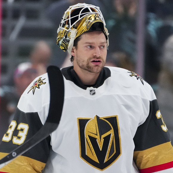 Vegas Golden Knights&#039; Pavel Dorofeyev, left, and goaltender Adin Hill, right, react after losing to the Seattle Kraken in overtime of an NHL hockey game Friday, Nov. 8, 2024, in Seattle. (AP Phot ...