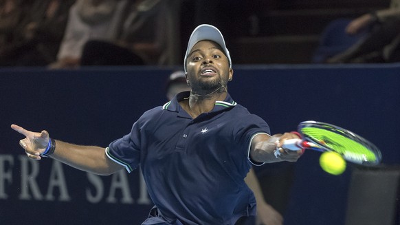 epa05606148 USA&#039;s Donald Young returns a ball to Switzerland&#039;s Stan Wawrinka during their round of sixteen match at the Swiss Indoors tennis tournament at the St. Jakobshalle in Basel, Switz ...