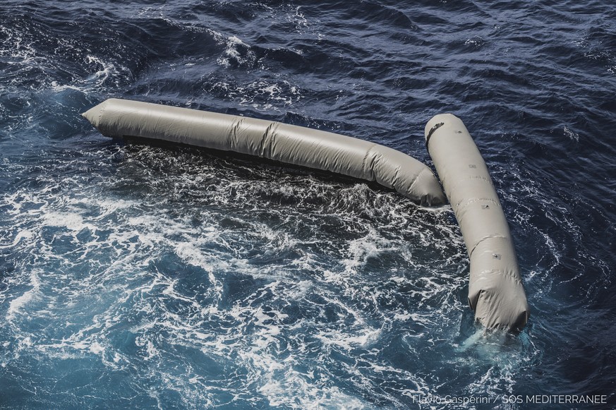 Debris from a dinghy which was supposedly carrying over 100 migrants are seen floating in the Mediterranean Sea northeast of the Libyan capital, Tripoli, Thursday, April 22, 2021. SOS Mediterranee, wh ...