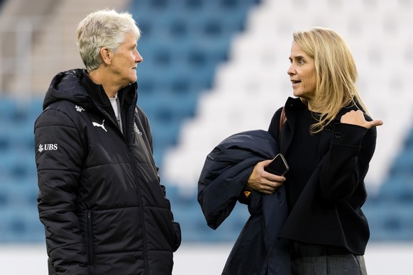Head coach Pia Sundhage of Switzerland, left, speaks with Marion Daube, SFV director of women&#039;s football, prior to the women&#039;s international friendly soccer match between Switzerland and Can ...
