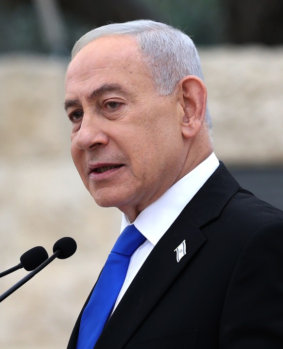 FILE - Israel's Prime Minister Benjamin Netanyahu attends a ceremony at the Military Cemetery on Mount Herzl in Jerusalem, April 21, 2026. (Ilia Yefimovich/Pool Photo via AP, File)
Israel Politic ...