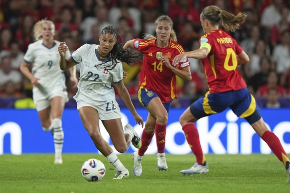 Switzerland&#039;s Sydney Schertenleib, second left, challenges for the ball with Spain&#039;s Irene Paredes, right, and Spain&#039;s Laia Aleixandri, centre, during the Women&#039;s Euro 2025 quarter ...