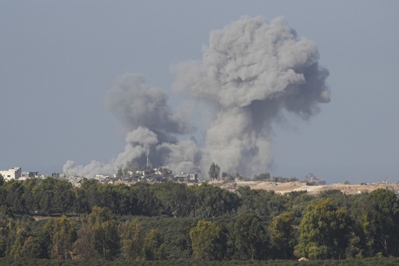 Smoke rises following an Israeli bombardment in the Gaza Strip, as seen from southern Israel on Monday, Dec. 4, 2023. (AP Photo/Ohad Zwigenberg)