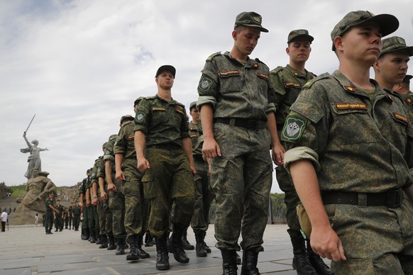 FILE - Russian army soldiers march during an action in support for the soldiers involved in the military operation in Ukraine, at the Mamaev Kurgan, a World War II memorial in Volgograd, Russia, July  ...