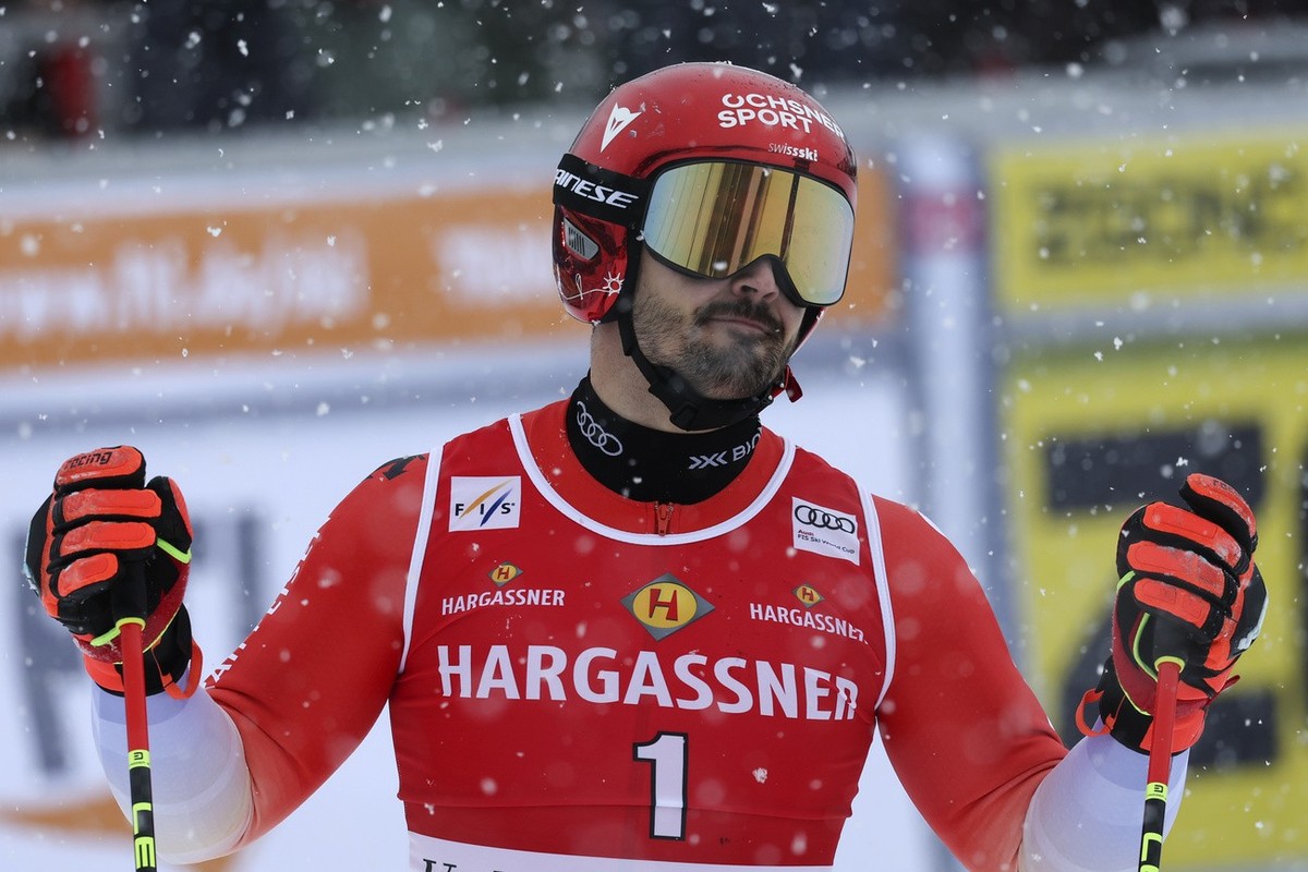 Switzerland's Loic Meillard reacts at the finish area of an alpine ski, men's World Cup giant slalom race, in Val d'Isere, France, Saturday, Dec.9, 2023. (AP Photo/Marco Trovati)