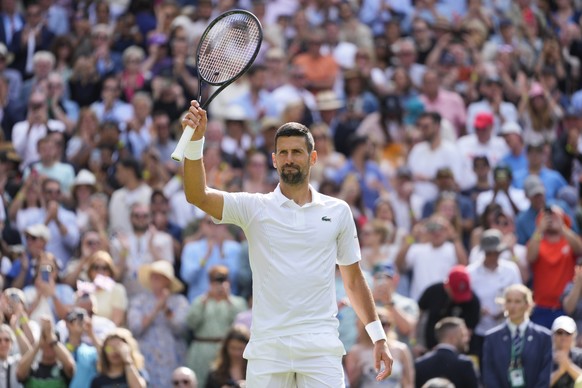 Serbia&#039;s Novak Djokovic waves after defeating Britain&#039;s Jacob Fearnley in their second round match at the Wimbledon tennis championships in London, Thursday, July 4, 2024. (AP Photo/Kirsty W ...