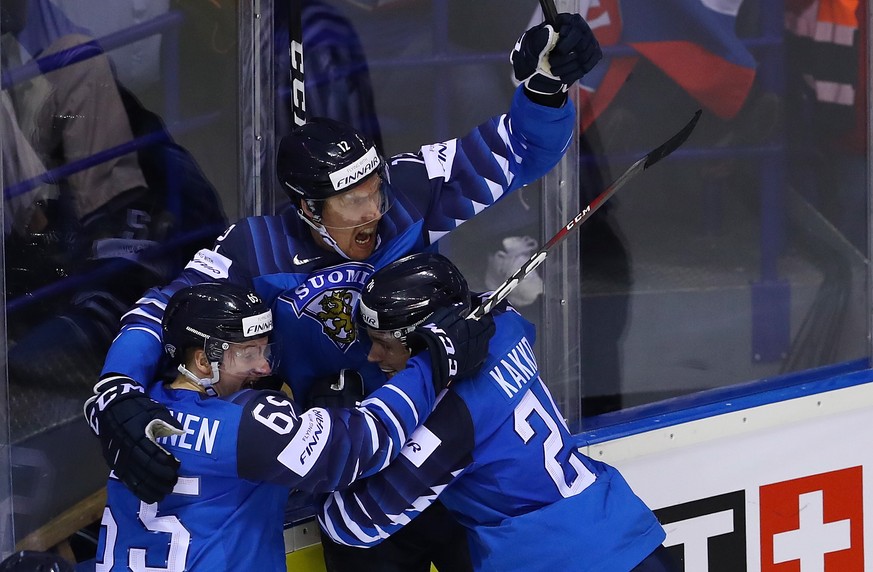 epa07595602 Marko Anttila of Finland (C) celebrates his 4-4 goal with team mates during the IIHF World Championship quarter final ice hockey match between Finland and Sweden at the Steel Arena in Kosi ...