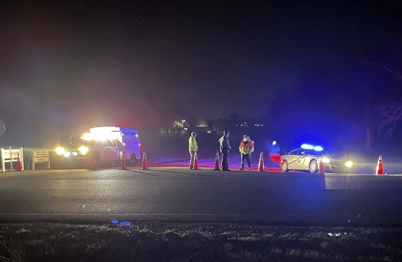 Rescuers were seen near a site where two military helicopters crashed Wednesday night during a routine training mission in Trigg County, southwestern Kentucky, on March 30, 2023. (Brando…