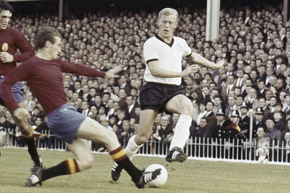 FILE - Karl-Heinz Schnellinger, right, West Germany?s defender in fight with two Spanish players during their Soccer World Cup match at Villa Park, Birmingham, England, United Kingdom on July 20, 1966 ...