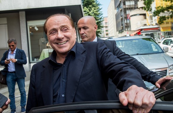 Silvio Berlusconi, president of Italian soccer club AC Milan, smiles after a meeting in a trust company in Lugano, Switzerland, Monday, June 8, 2015 after negotiating giving a 48 percent stake in AC M ...