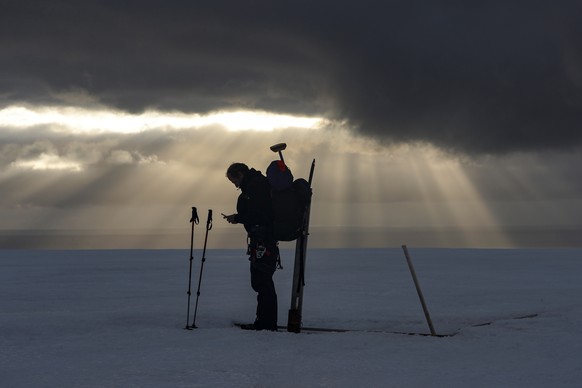 epa08381181 (17/49) Chilean glaciologist Gino Casassa registers the GPS coordinates of a stake placed in the Bellingshausen Dome in King George Island in the South Shetland Islands, Antarctica, 10 Mar ...