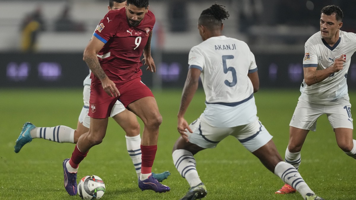 Serbia's Aleksandar Mitrovic in action in front of Switzerland's Manuel Akanji during the UEFA Nations League soccer match between Serbia and Switzerland at the Dubocica Stadium in Leskovac, ...