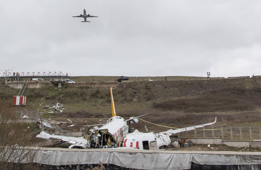 epa08196951 A general view of the wreckage 06 February 2020 after a Pegasus Airlines aircraft skidded off the Sabiha Goekcen airport runway in Istanbul, Turkey, 05 February 2020. Three people were kil ...
