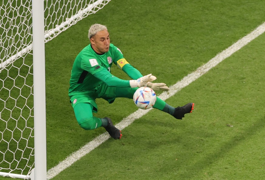 epa10342560 Goalkeeper Keylor Navas of Costa Rica.makes a save during the FIFA World Cup 2022 group E soccer match between Costa Rica and Germany at Al Bayt Stadium in Al Khor, Qatar, 01 December 2022 ...