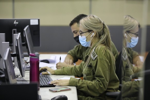 epa08729071 Israeli soldiers in the central national control room Headquarters of the Home Front Command dealing with the coronavirus COVID-19 in the city of Ramla near Tel Aviv, 08 October 2020. The  ...