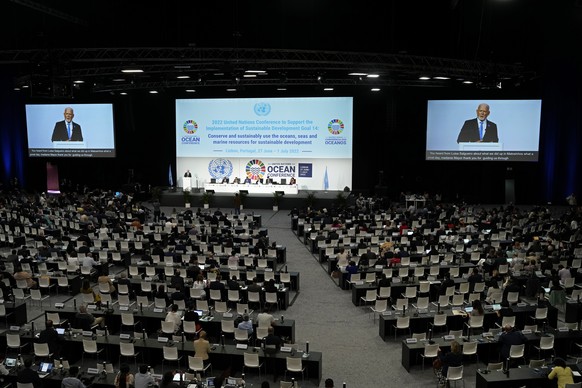 United Nations&#039; Special Envoy for the Ocean Peter Thomson, on the video screen, addresses the United Nations Ocean Conference in Lisbon, Friday, July 1, 2022. From June 27 to July 1, the United N ...