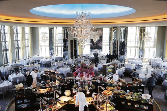 Chefs prepare a lavish spread of food before lunchtime guests arrive at the Rainbow Room, New York City’s landmark restaurant atop 30 Rockefeller Plaza, Sunday, Oct. 5, 2014. The Rainbow Room reopened ...