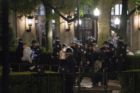 Officers with the New York Police Department arrest Pro-Palestinian protesters at Columbia University, Tuesday, April 30, 2024, in New York. The protesters had seized the administration building, know ...