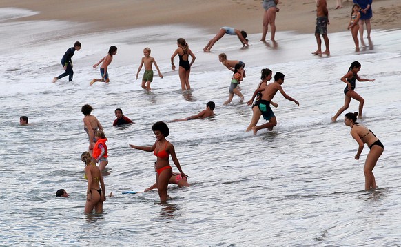 People enjoy the sea at Atlantic Ocean in Biarritz, southwestern France , Wednesday, Oct. 26, 2022. Temperatures in southwestern France have mounted all week and were expected to hit over 30° Celcius  ...