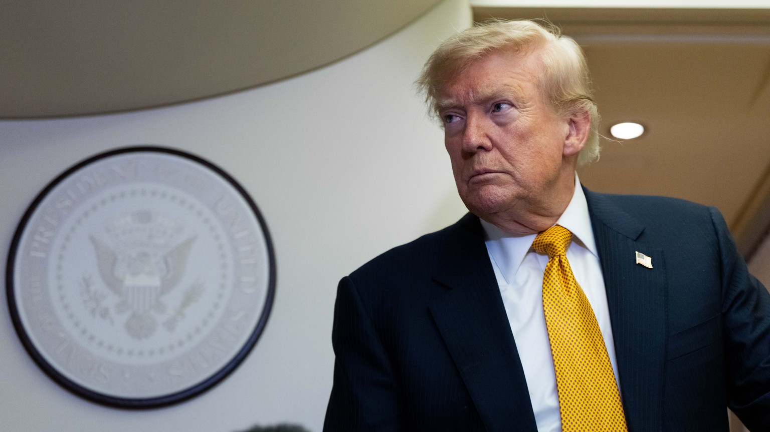President Donald Trump speaks with reporters in flight on Air Force One after landing at U.S. Air Force Base at RAF Mildenhall, in Suffolk, Eastern England, Wednesday, July 8, 2026. (AP Photo/Alex Bra ...