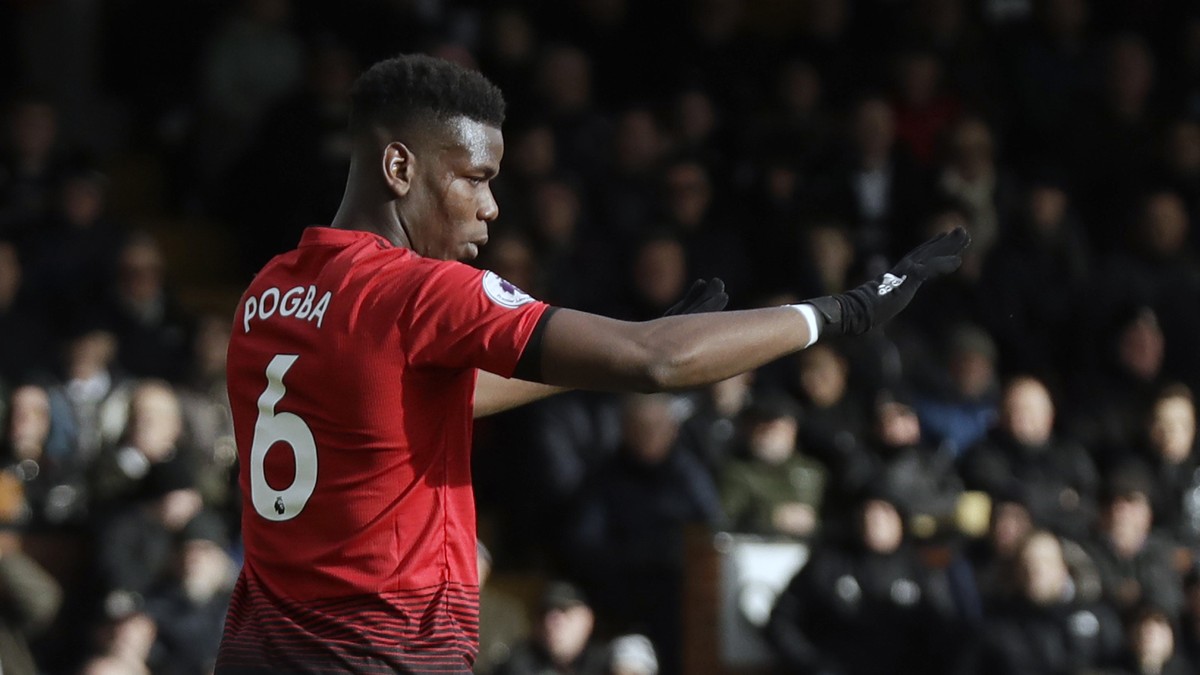Manchester United's Paul Pogba celebrates after scoring his side's third goal from penalty during the English Premier League soccer match between Fulham and Manchester United at Craven Cotta ...