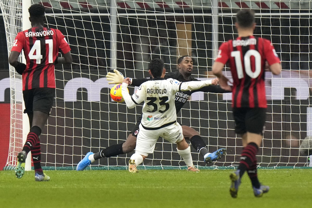 Spezia's Kevin Agudelo scores against AC Milan during a Serie A soccer match between AC Milan and Spezia, at the San Siro stadium in Milan, Italy, Monday, Jan.17, 2022. (AP Photo/Luca Bruno)