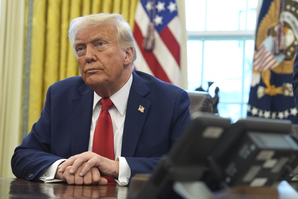 President Donald Trump listens after signing executive orders in the Oval Office of the White House, Monday, Feb. 3, 2025, in Washington. (AP Photo/Evan Vucci)
Donald Trump